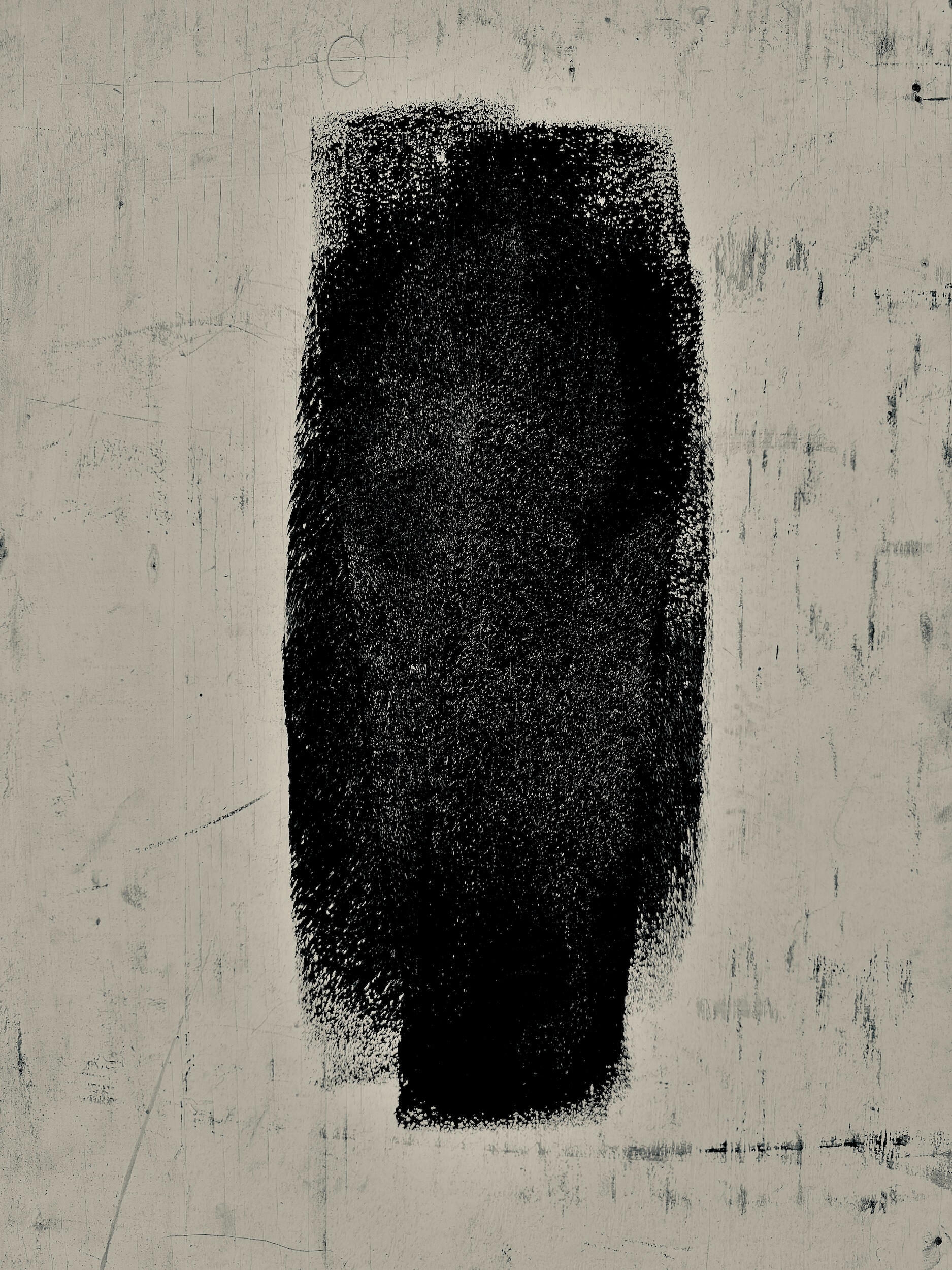 solo single - glyph | LA A singular, isolated black geometric mark centered on a grit-textured urban backdrop. Industrial noir black-and-white photography, Los Angeles, California. 1/1 archival pigment print by Barton Caplan